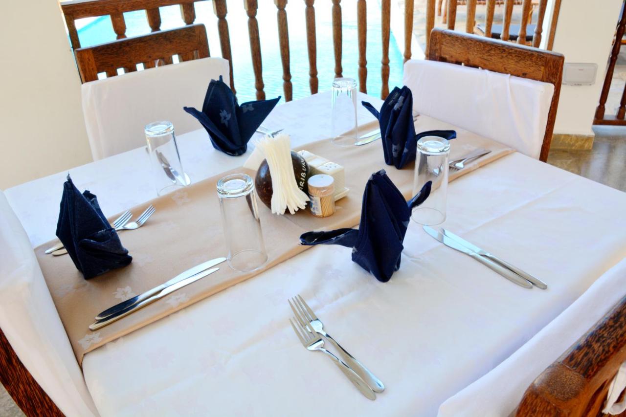 Table set for dinner beside the pool at the Zante Restaurant