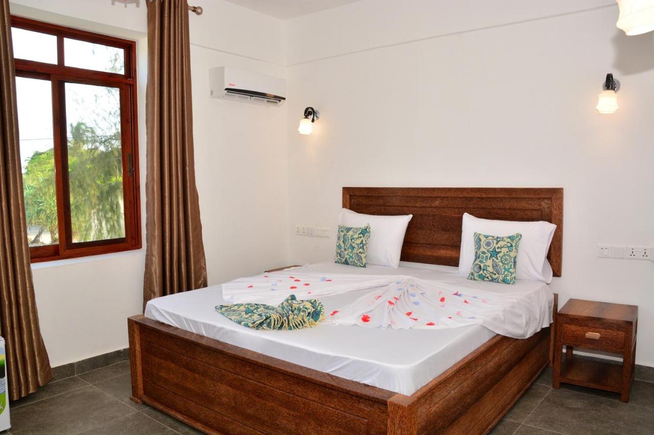 Bright Standard Double room with carved wooden furniture and AC